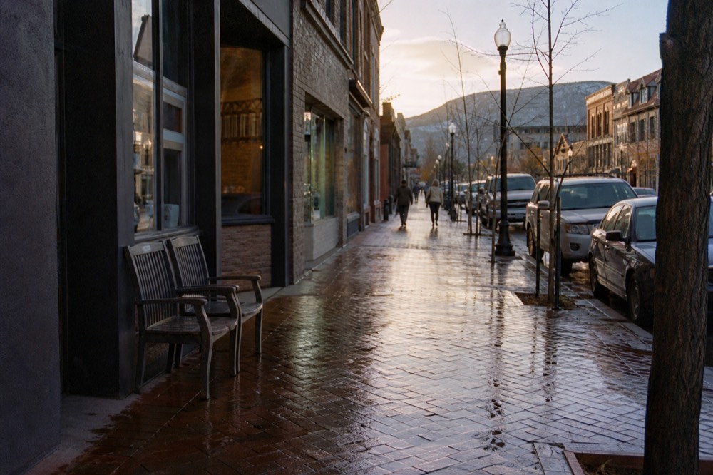 A small lake town main street near Canandaigua with shops and tasting rooms, no text, no logos, no people
